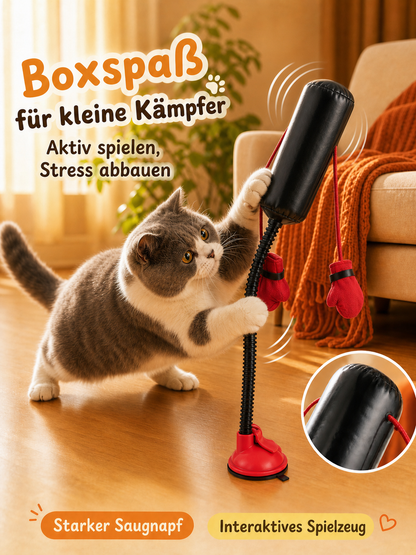 PawPunch cat boxing toy with a playful cat on a smooth wooden floor